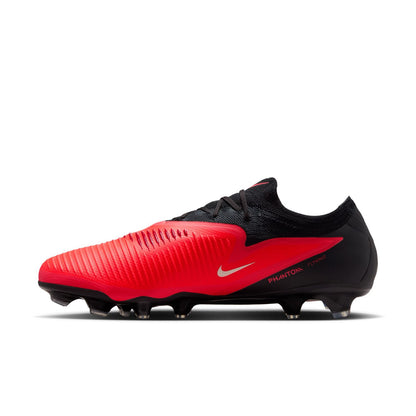 Nike Phantom 6 Low Pro FG red and black firm-ground soccer cleats with VNMSkin upper and Cyclone 360 traction plate.
