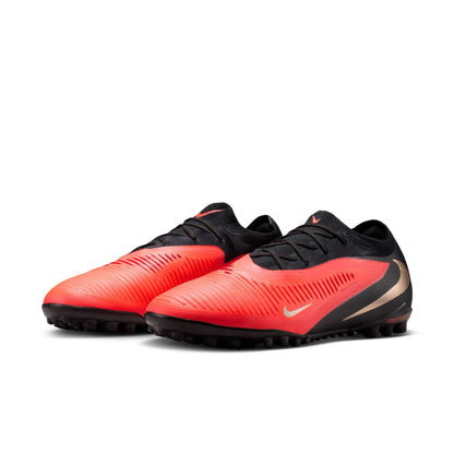 Nike Phantom 6 Low Pro TF red and black turf soccer shoes with VNMSkin upper and rubber outsole.