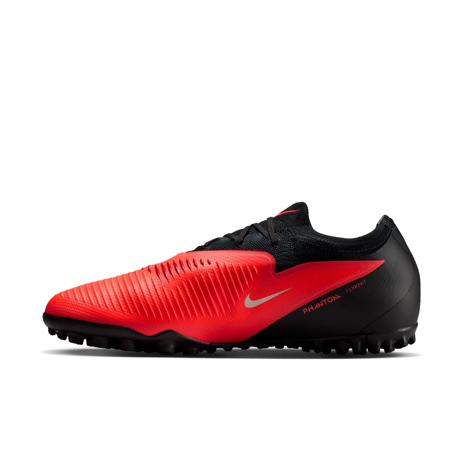 Nike Phantom 6 Low Pro TF red and black turf soccer shoes with VNMSkin upper and rubber outsole.