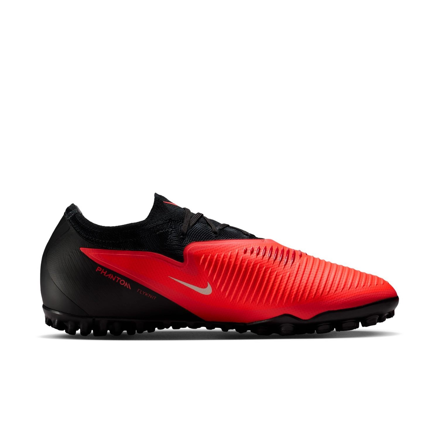 Nike Phantom 6 Low Pro TF red and black turf soccer shoes with VNMSkin upper and rubber outsole.
