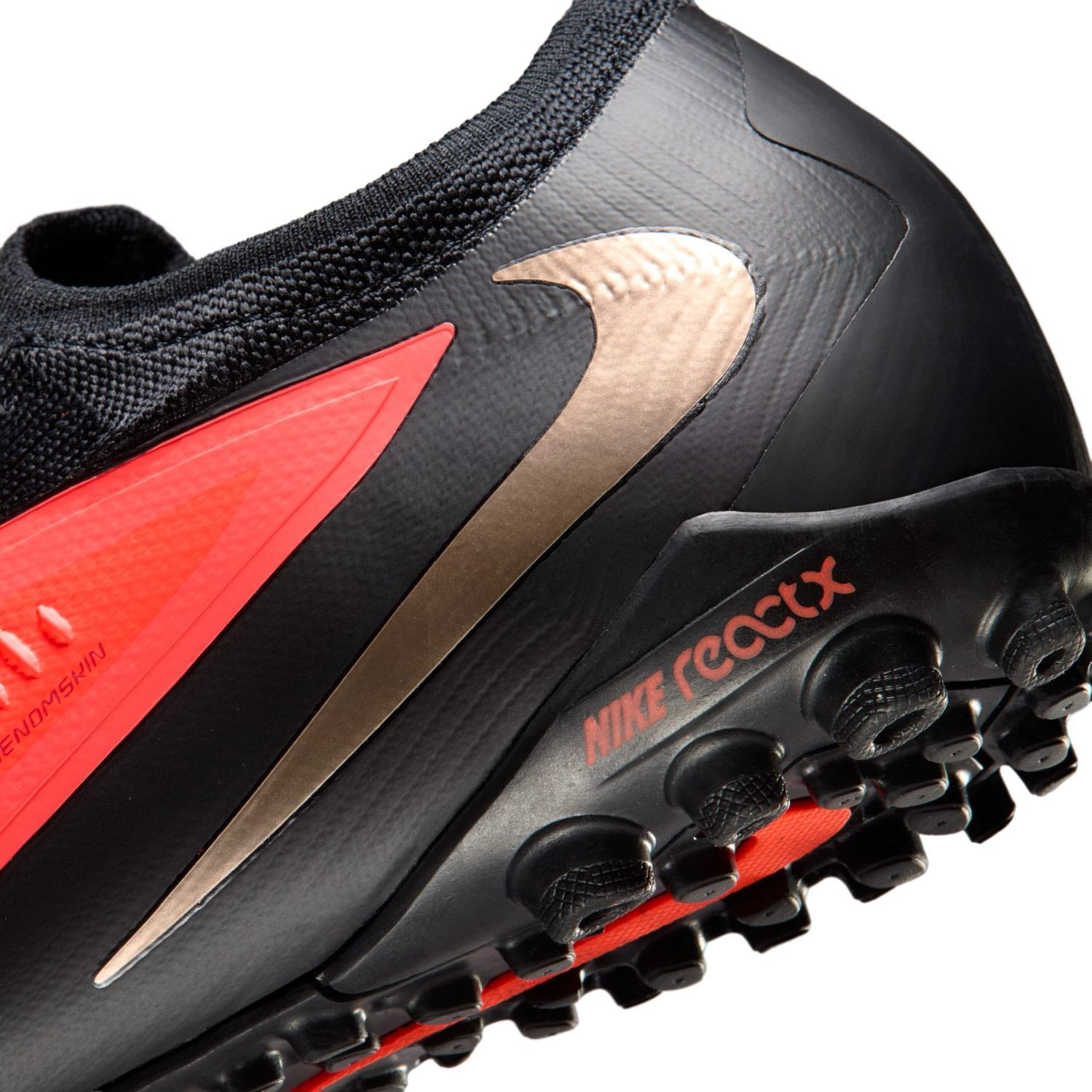 Nike Phantom 6 Low Pro TF red and black turf soccer shoes with VNMSkin upper and rubber outsole.