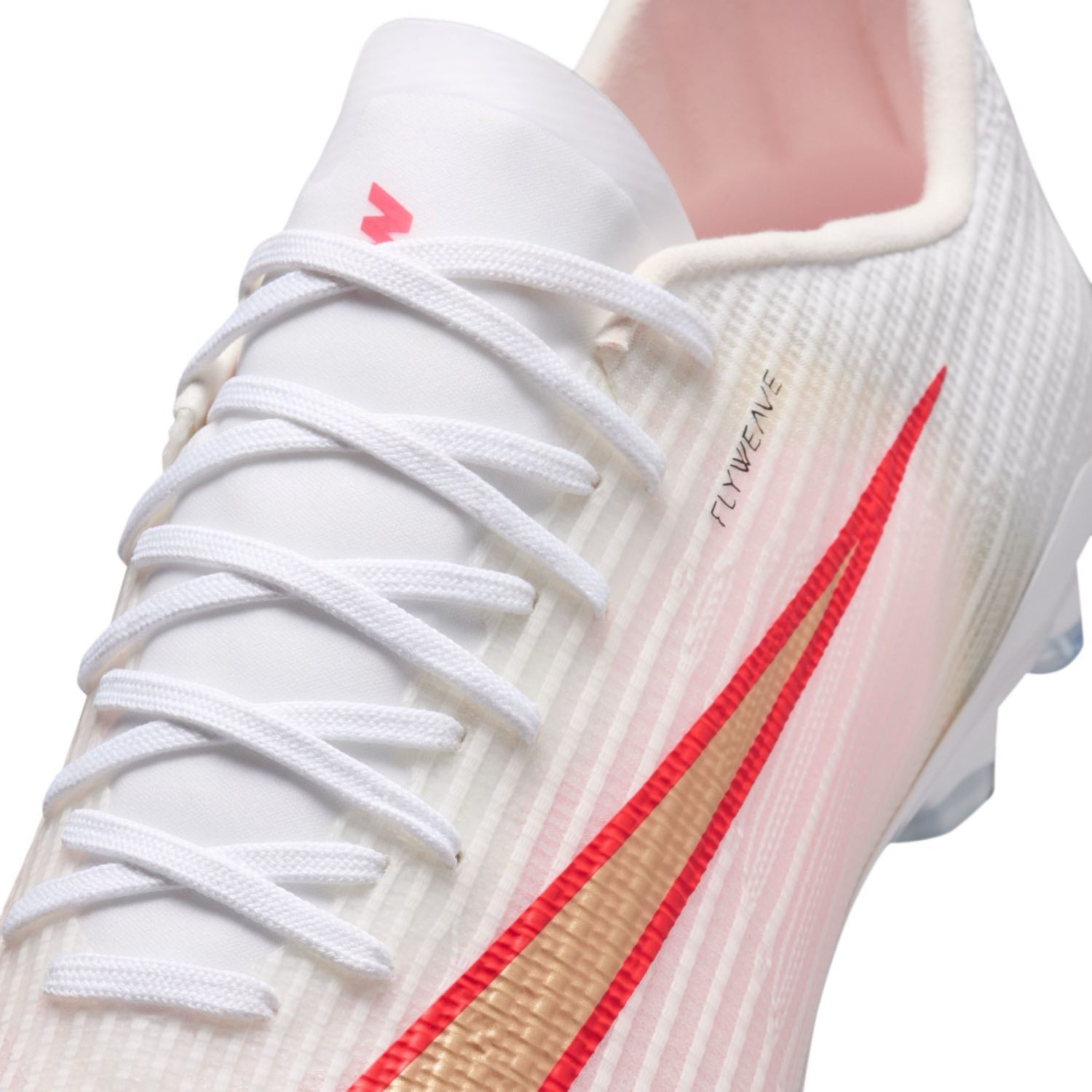 Nike Mercurial Superfly 11 Pro AG low-top artificial-grass soccer cleats in white with orange details and Air Zoom cushioning.